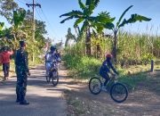 Babinsa Posramil 0822/12 Pengamanan Gowes Sumber Wringin